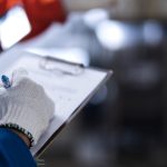 close up female engineer hand controling robot arm welding machine industrial 4.0 modern factory background,smart female engineer inspect quality control in factory